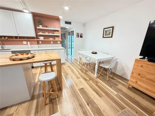 a dining room with a table and chairs
