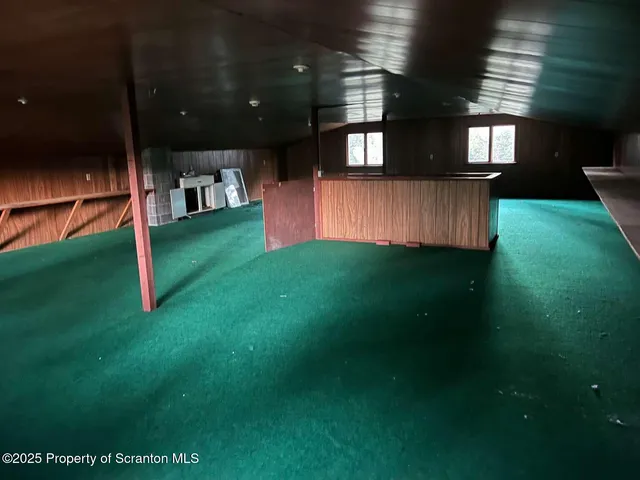 a view of a living room with a fireplace
