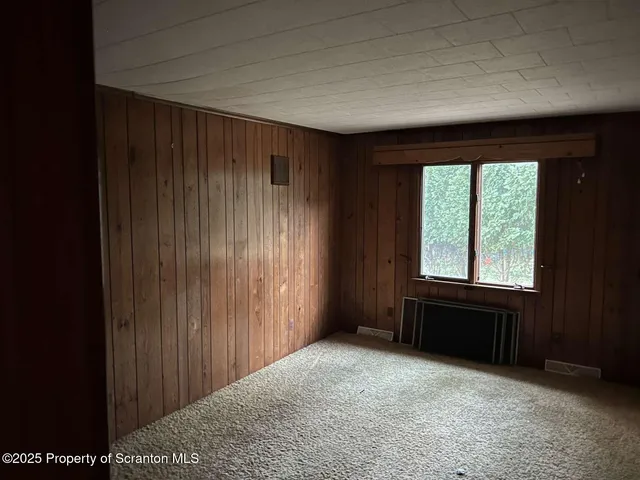 a bathroom with a toilet and shower