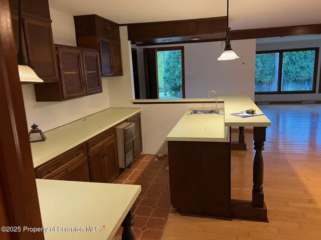 a bathroom with a sink a mirror and window