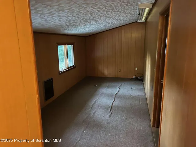 a view of an empty room with windows