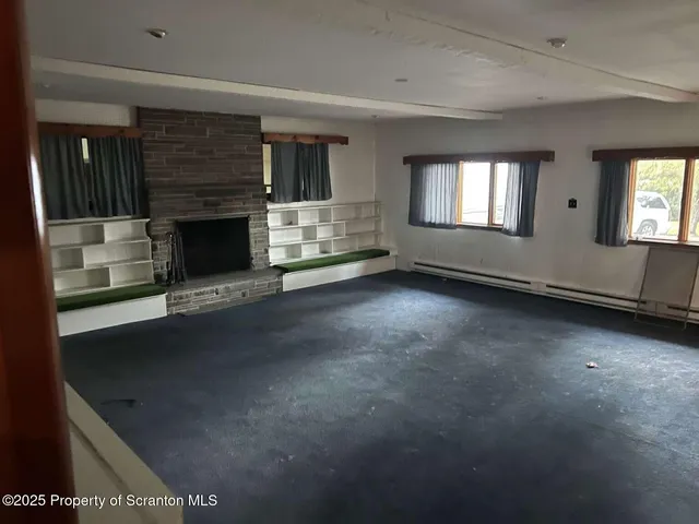 an empty room with windows
