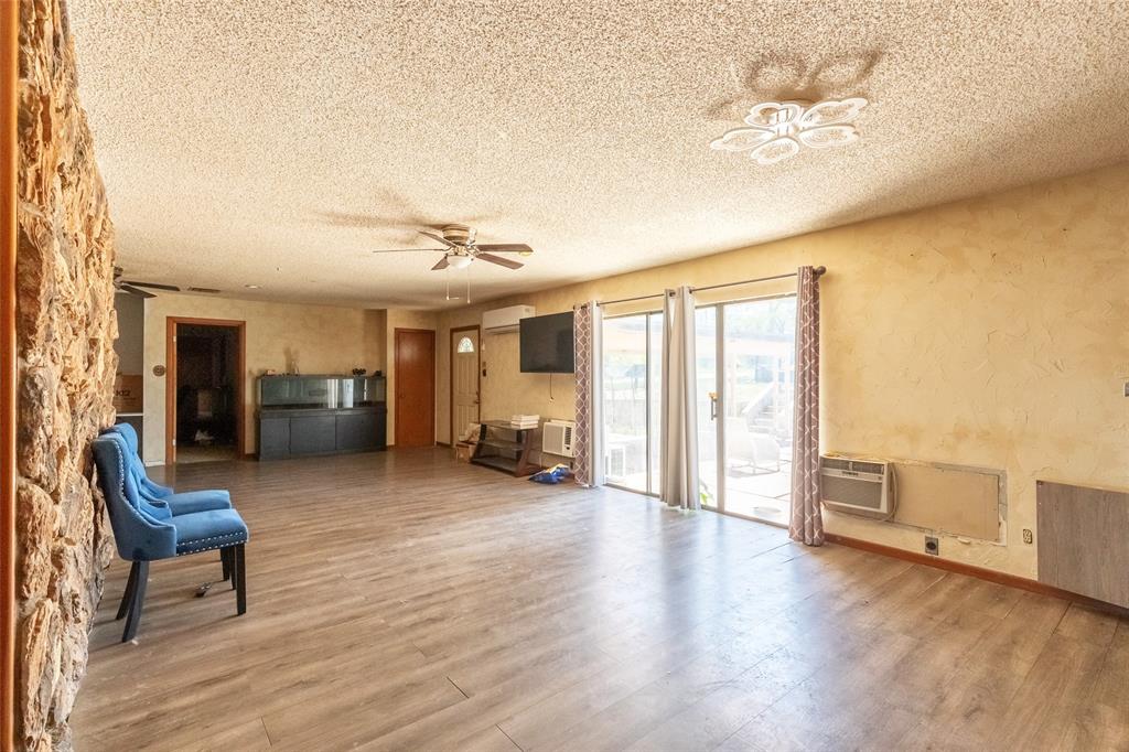 36 Poverty Point Circle Abilene, TX 79601 - Photo 11 of 31 a living room with furniture and a large window