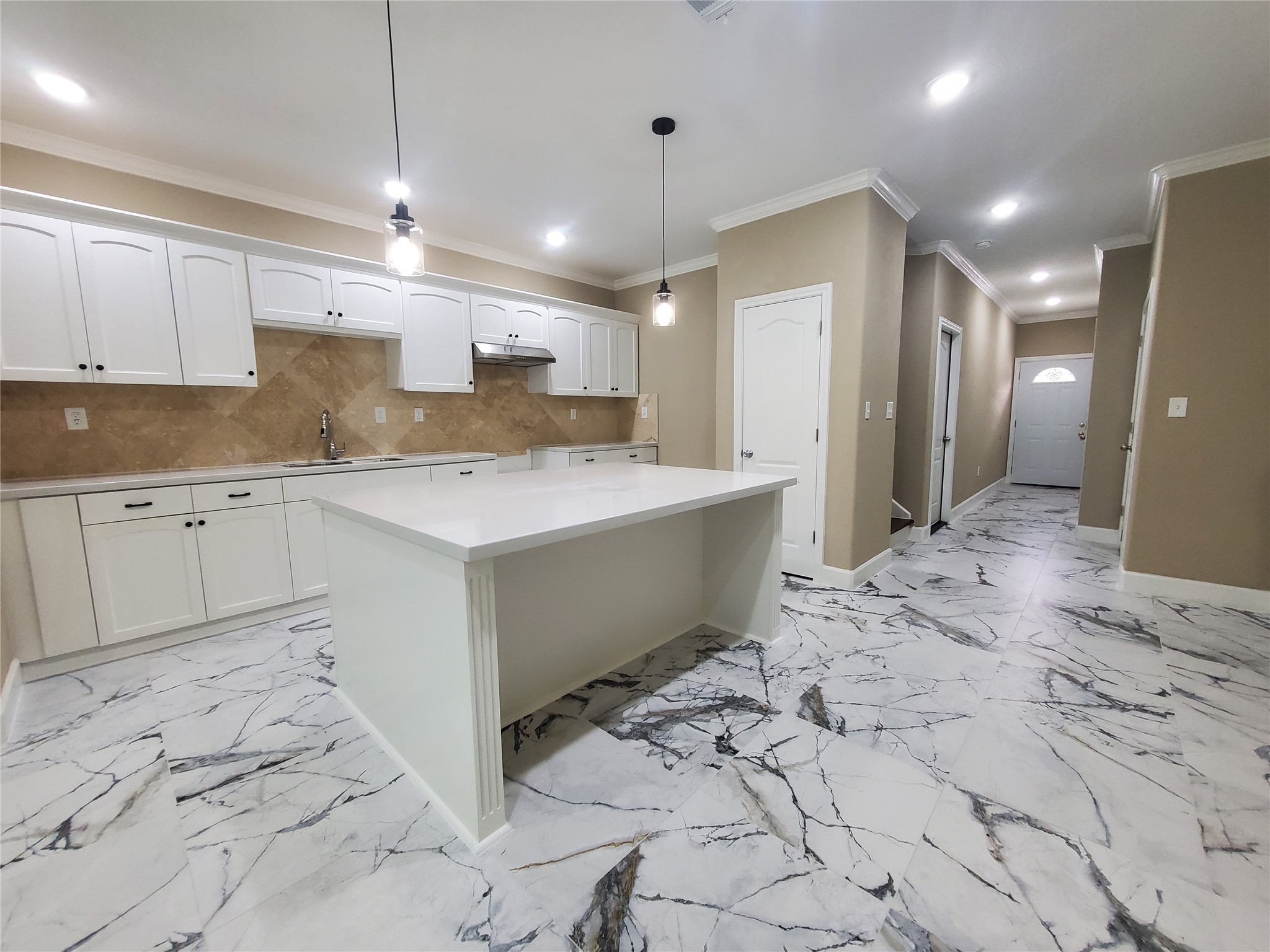 1306 North 9th Street Conroe, TX 77301 - Photo 28 of 47 a view of a kitchen with kitchen island a sink stainless steel appliances counter space and a window