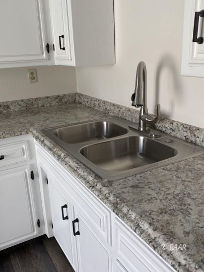 1010 Peg Street Ridgecrest, CA 93555 - Photo 6 of 17 a close view of a sink and tap