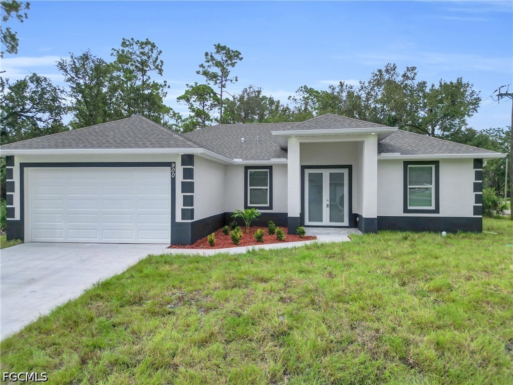 2115 Polar Avenue Alva, FL 33920 - Photo 1 of 26 front view of a house with a yard