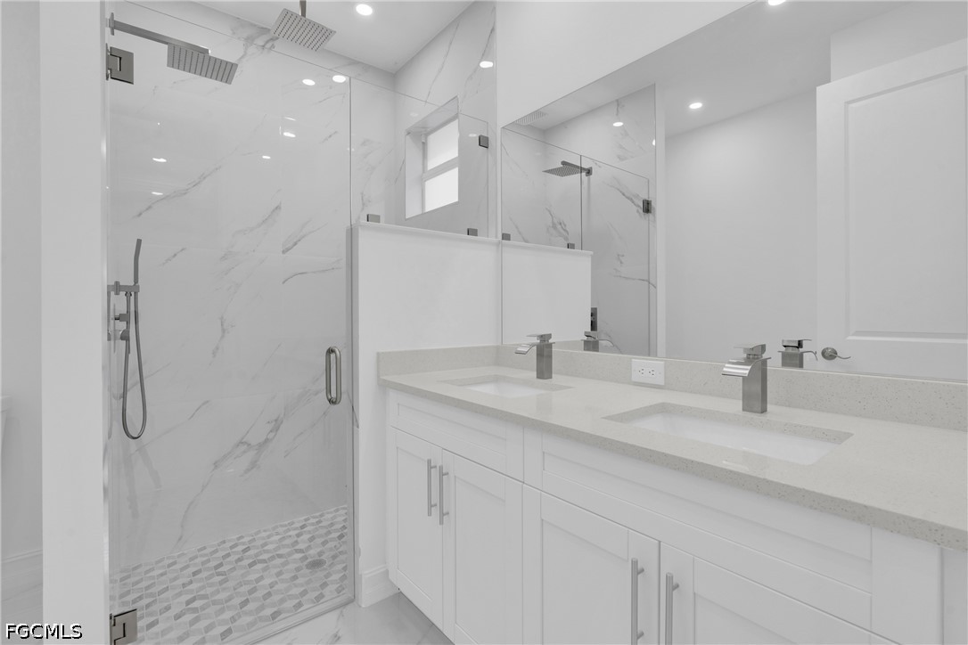 2115 Polar Avenue Alva, FL 33920 - Photo 17 of 26 a bathroom with a granite countertop sink mirror and shower