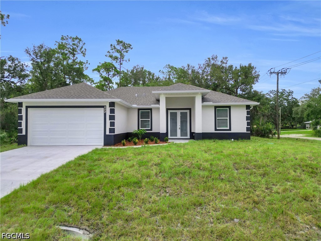 2115 Polar Avenue Alva, FL 33920 - Photo 2 of 26 a front view of house with yard and green space