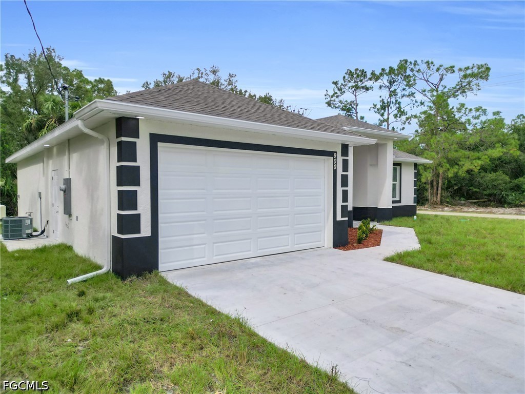 2115 Polar Avenue Alva, FL 33920 - Photo 5 of 26 a view of a house with a yard and garage