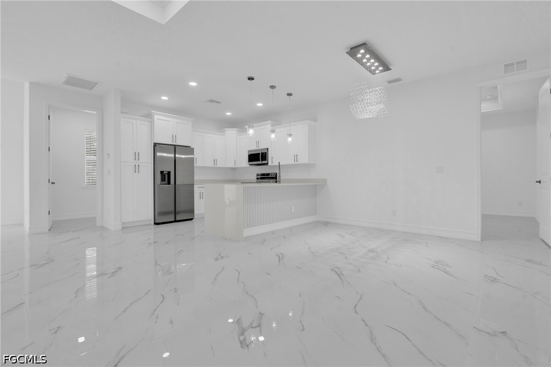 2115 Polar Avenue Alva, FL 33920 - Photo 6 of 26 a view of a kitchen with refrigerator and a sink