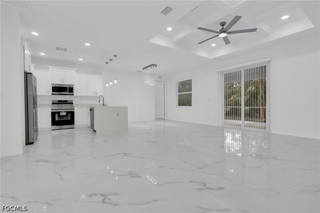 2115 Polar Avenue Alva, FL 33920 - Photo 9 of 26 a view of an empty room with kitchen and window