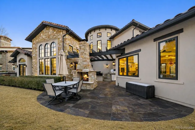 a view of a house with a large window and couches
