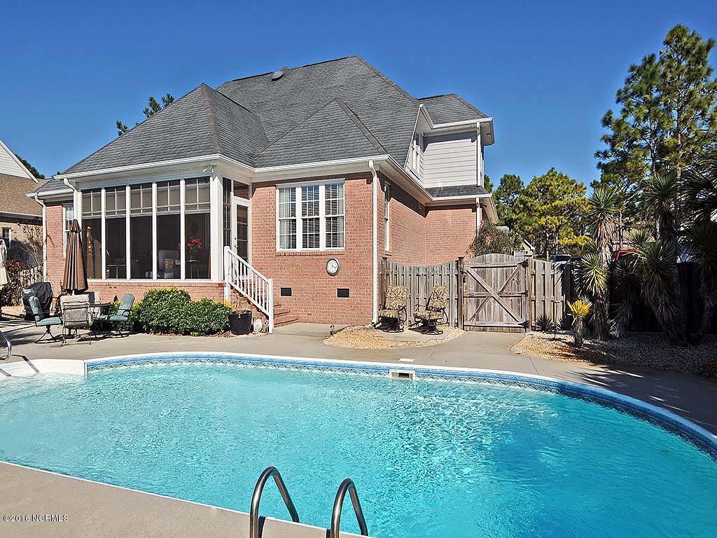 416 Rivage Promenade Wilmington, NC 28412 - Photo 2 of 51 Sunroom over looks Pool & Golf Course