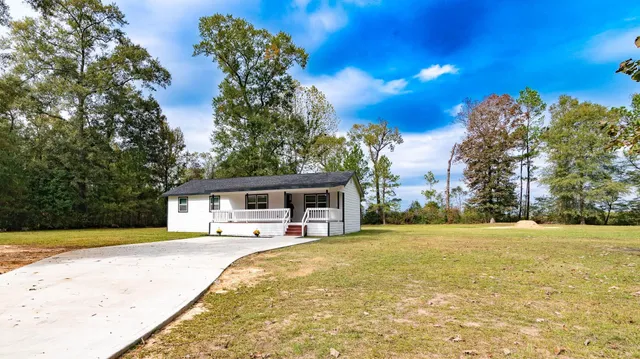 a view of a house with swimming pool