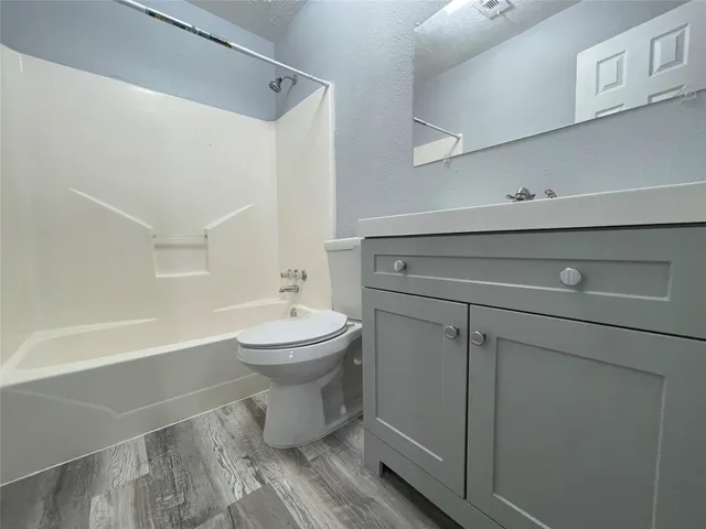 a view of a lake with a yard