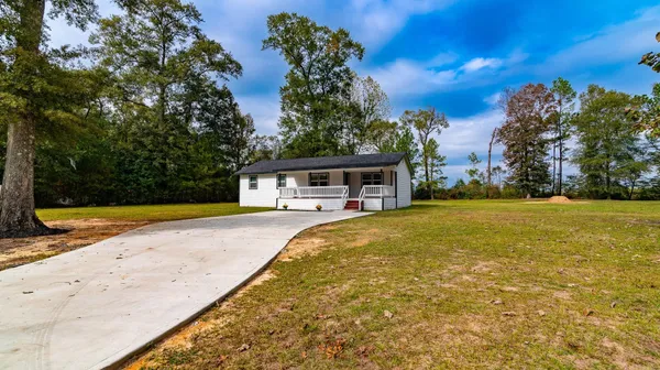 a view of house with swimming pool