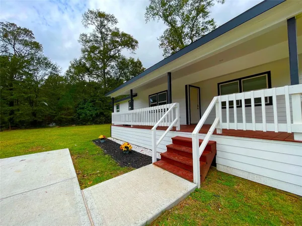 a view of balcony with floor to ceiling windows and pool table