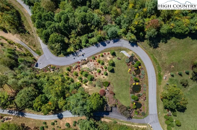 an aerial view of a swimming pool and outdoor space