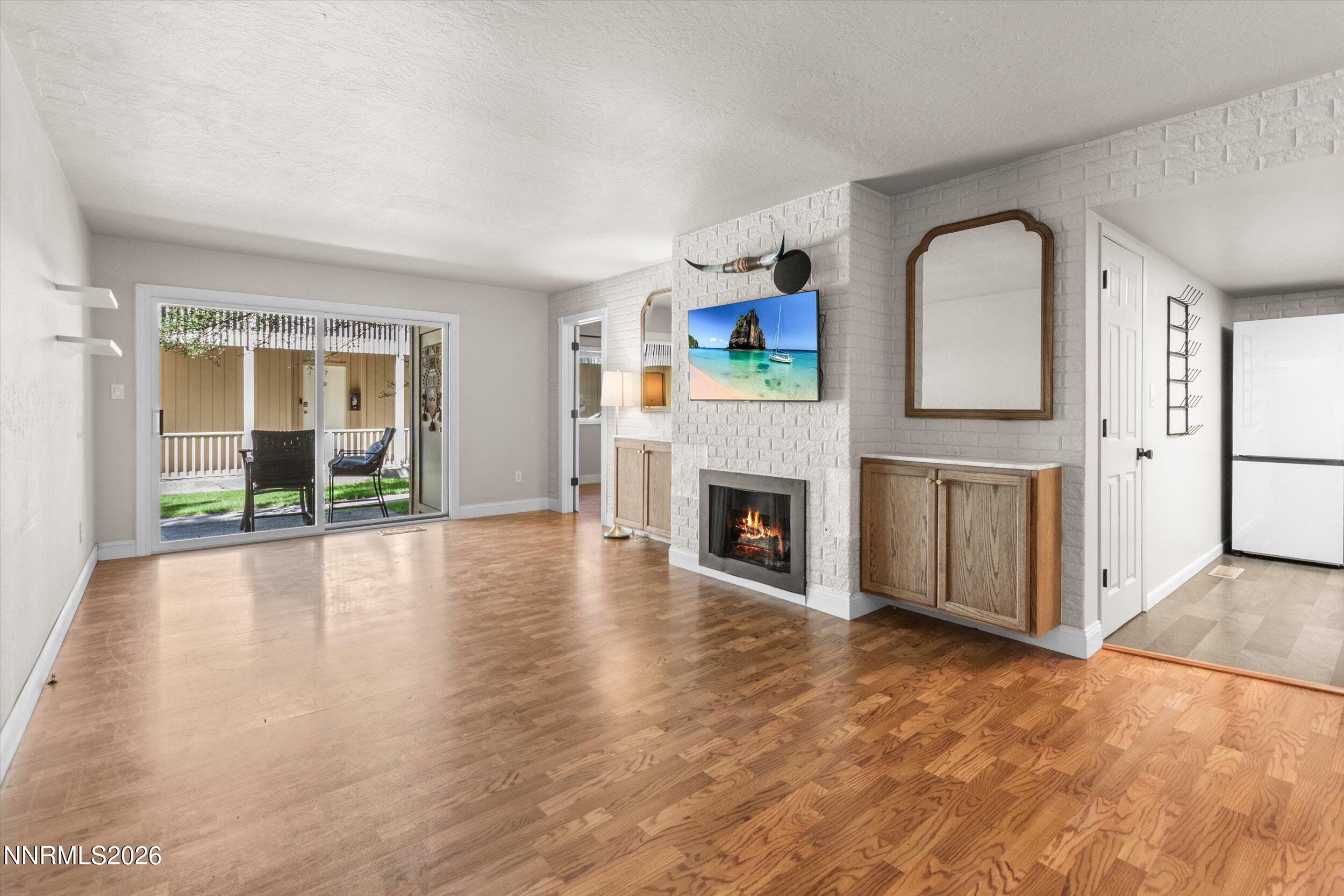 2300 Dickerson Road, Unit 51 Reno, NV 89503 - Photo 1 of 46 a view of empty room with floor to ceiling window and fireplace