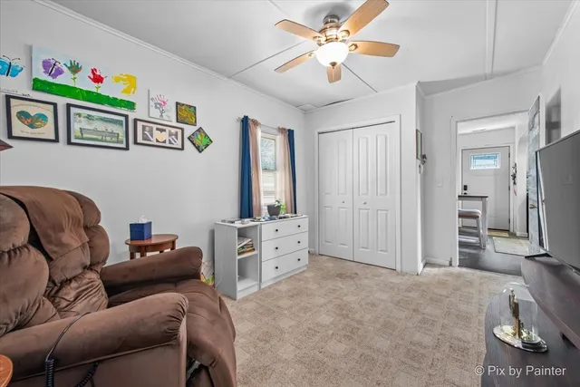a bedroom with furniture and a chandelier