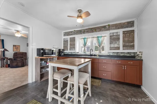 a kitchen with a sink and cabinets