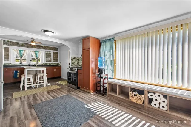 a living room with furniture and next to a window