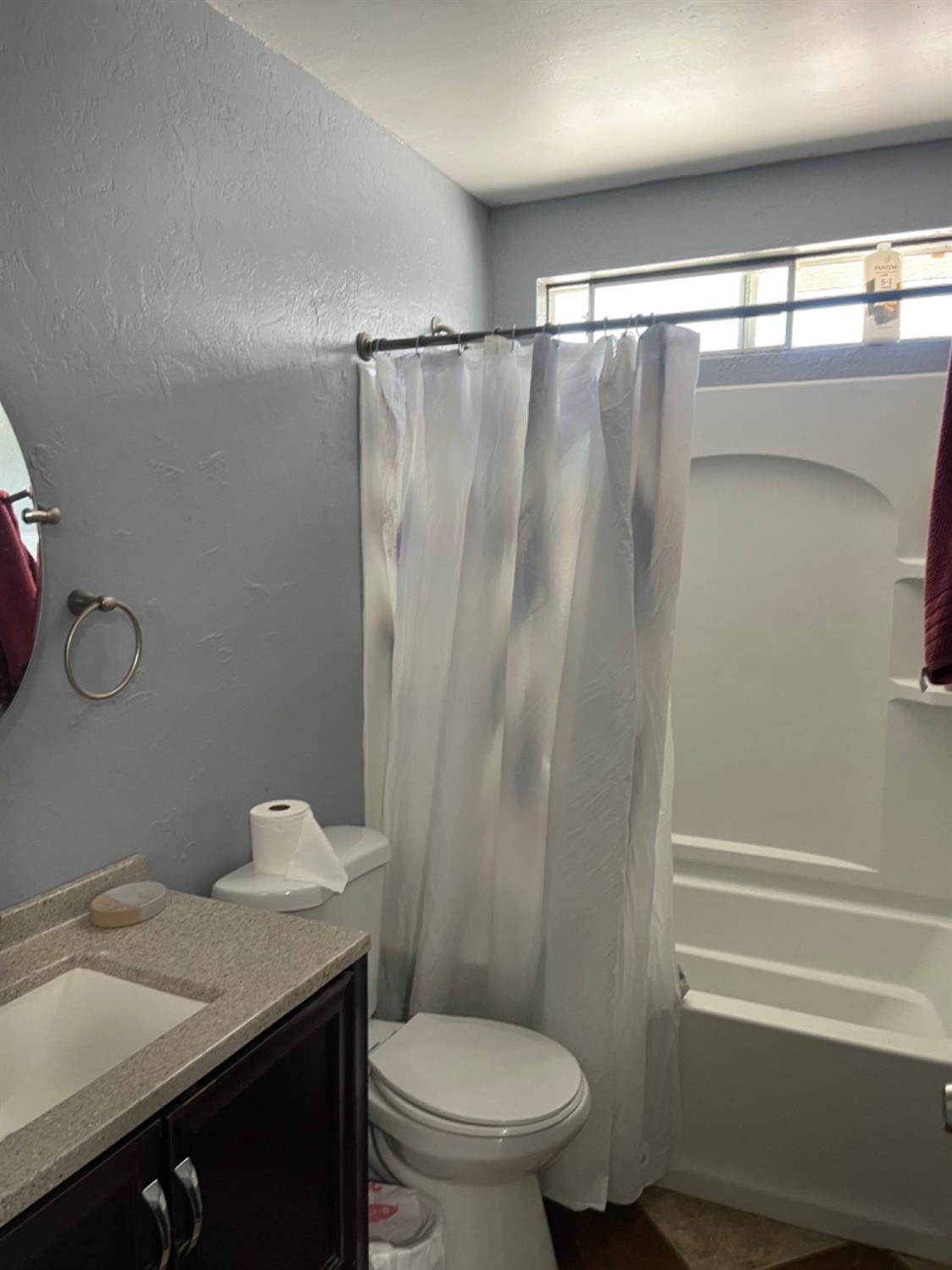 1978 Cline Street Firebaugh, CA 93622 - Photo 7 of 9 a bathroom with a granite countertop sink toilet and shower