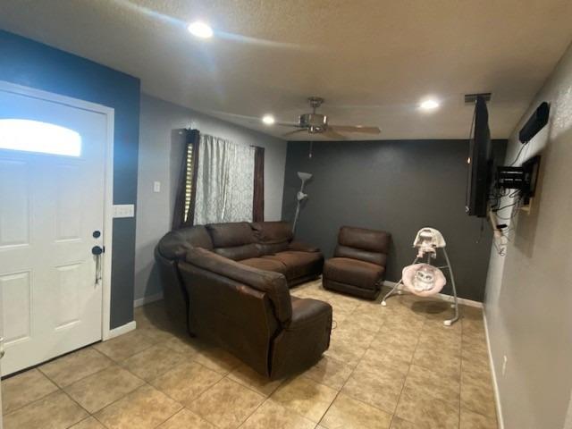 1978 Cline Street Firebaugh, CA 93622 - Photo 9 of 9 a living room with furniture a couch and a window