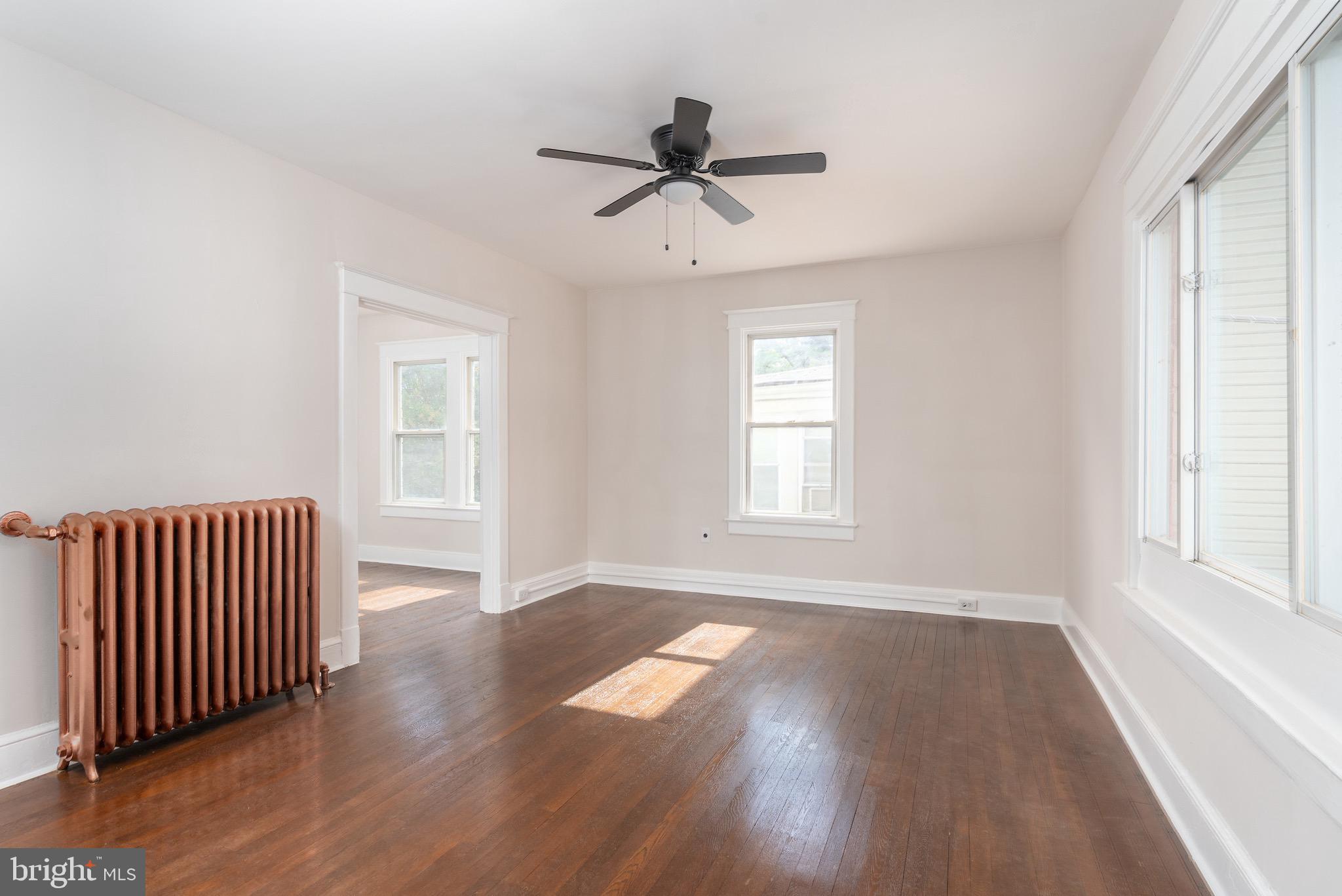 4317 River Road Northwest Washington, DC 20016 - Photo 3 of 22 Large sun-filled Living Room with Hardwood Floors