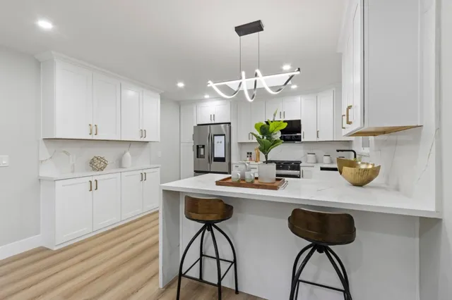 a living room with fireplace furniture and a wooden floor