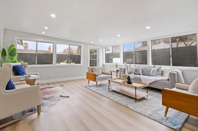 a living room with furniture and a table