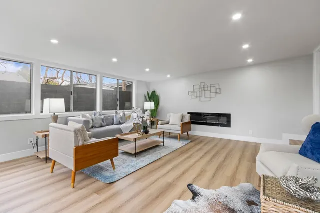 a living room with furniture and a rug