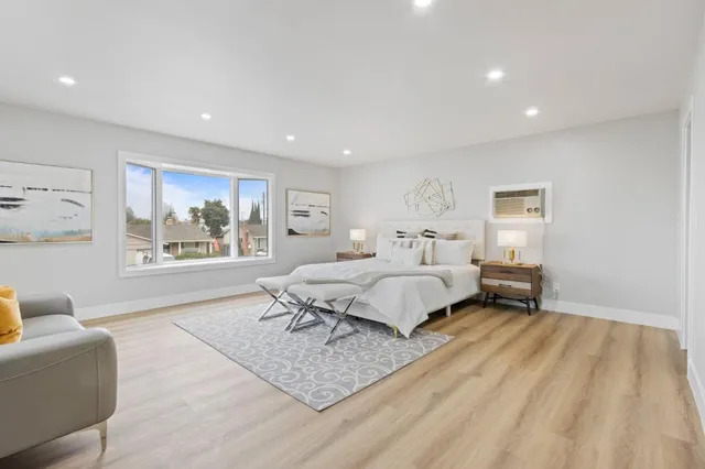 a bed room with a bed and a window