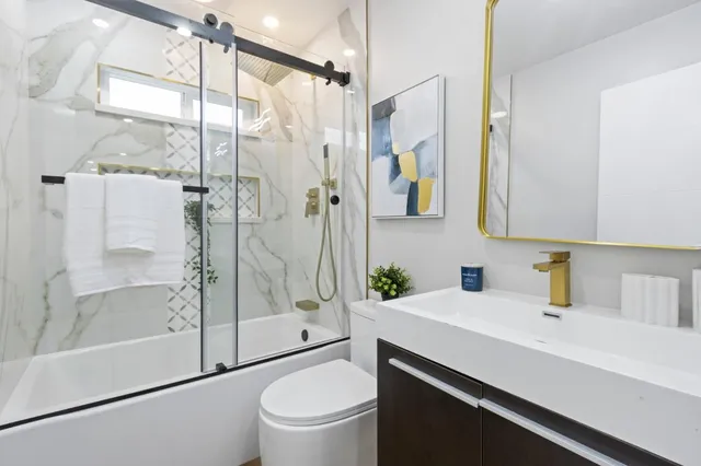 a bathroom with a sink a vanity and a mirror