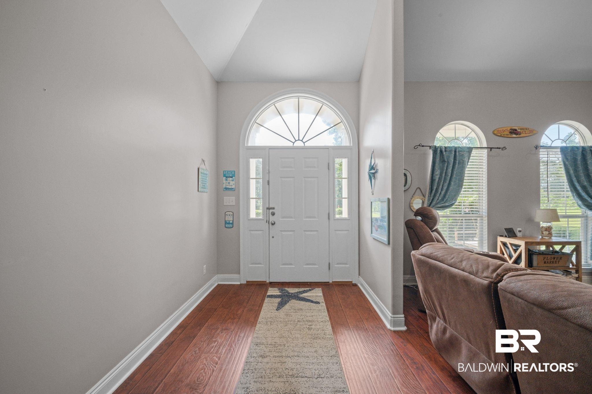 48513 Phillipsville Road Bay Minette, AL 36507 - Photo 7 of 50 Entryway with plenty of natural light, dark wood-style floors, and vaulted ceiling