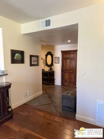 a living room with furniture and large windows