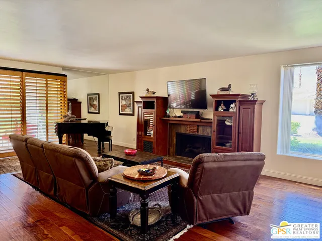 a view of a livingroom with furniture and a flat screen tv