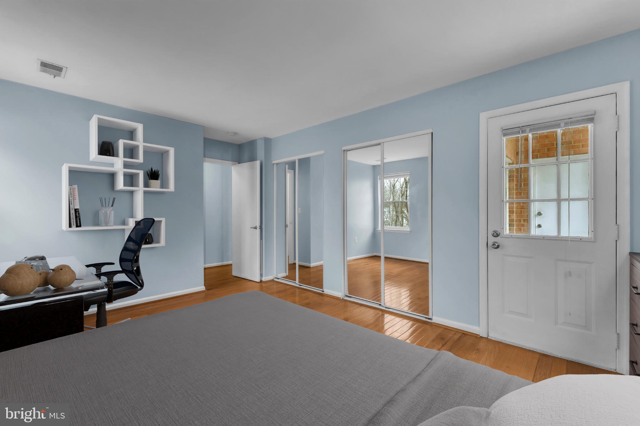 18334 Streamside Drive, Unit 201 Gaithersburg, MD 20879 - Photo 15 of 22 a bedroom with furniture and a window