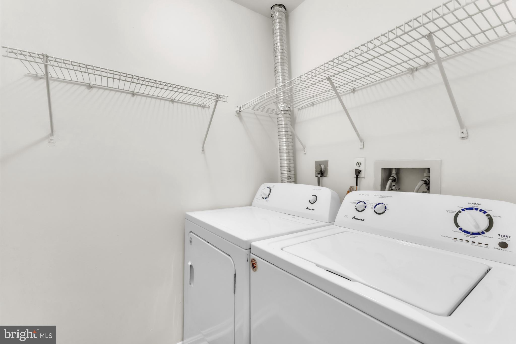 18334 Streamside Drive, Unit 201 Gaithersburg, MD 20879 - Photo 21 of 22 a utility room with dryer and washer