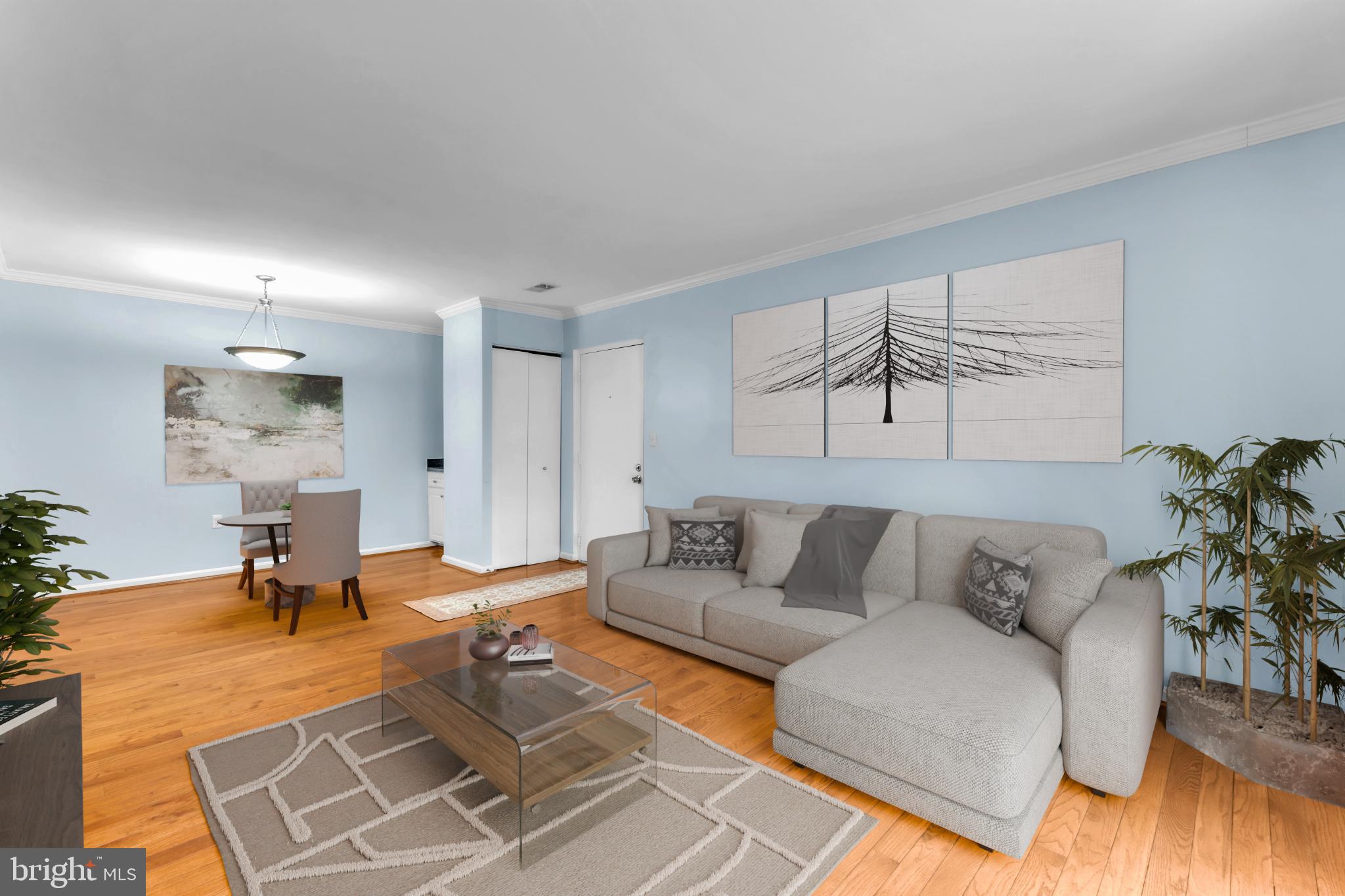 18334 Streamside Drive, Unit 201 Gaithersburg, MD 20879 - Photo 6 of 22 a living room with furniture and wooden floor