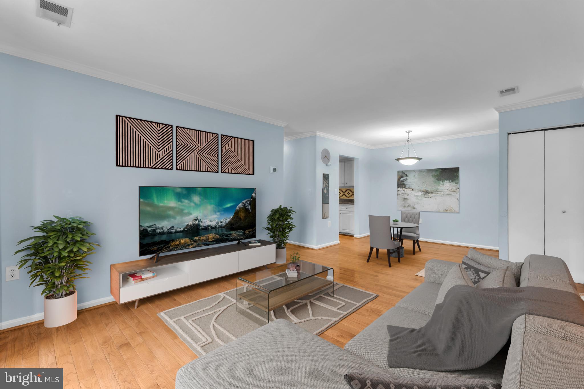 18334 Streamside Drive, Unit 201 Gaithersburg, MD 20879 - Photo 8 of 22 a living room with furniture and a flat screen tv