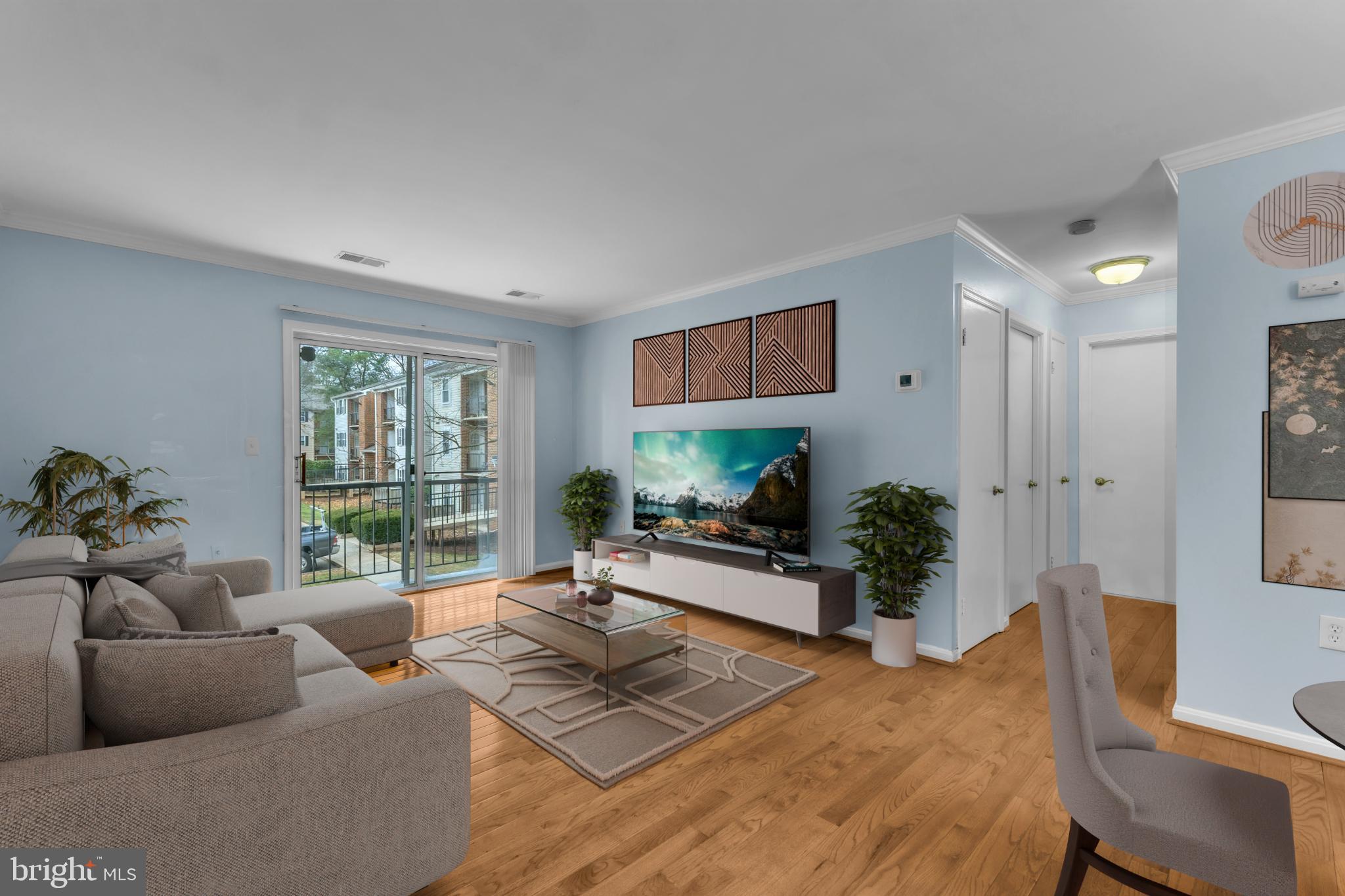 18334 Streamside Drive, Unit 201 Gaithersburg, MD 20879 - Photo 10 of 22 a living room with furniture and a large window