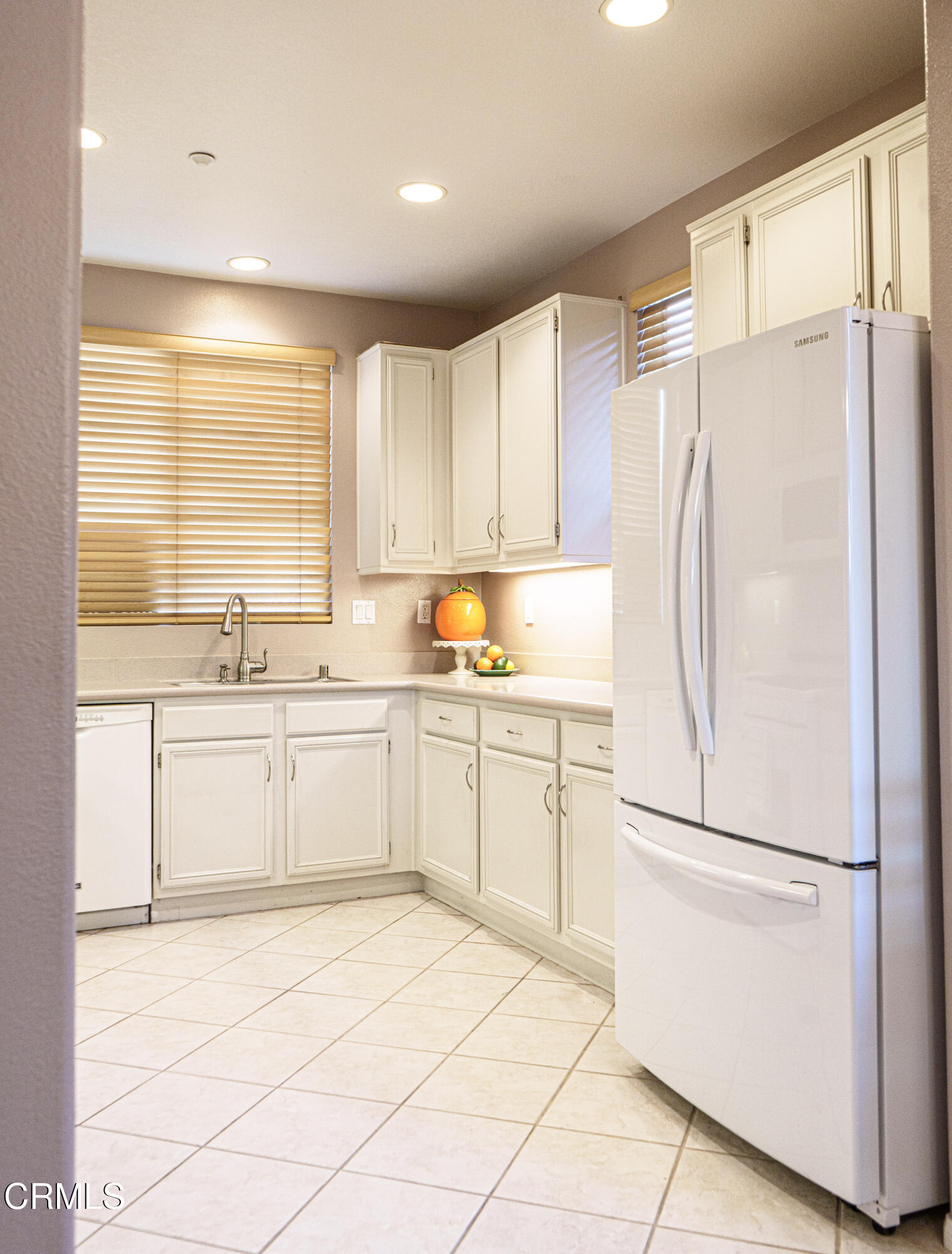 3840 Shakespeare Drive Oxnard, CA 93033 - Photo 12 of 46 a kitchen with a refrigerator sink and cabinets