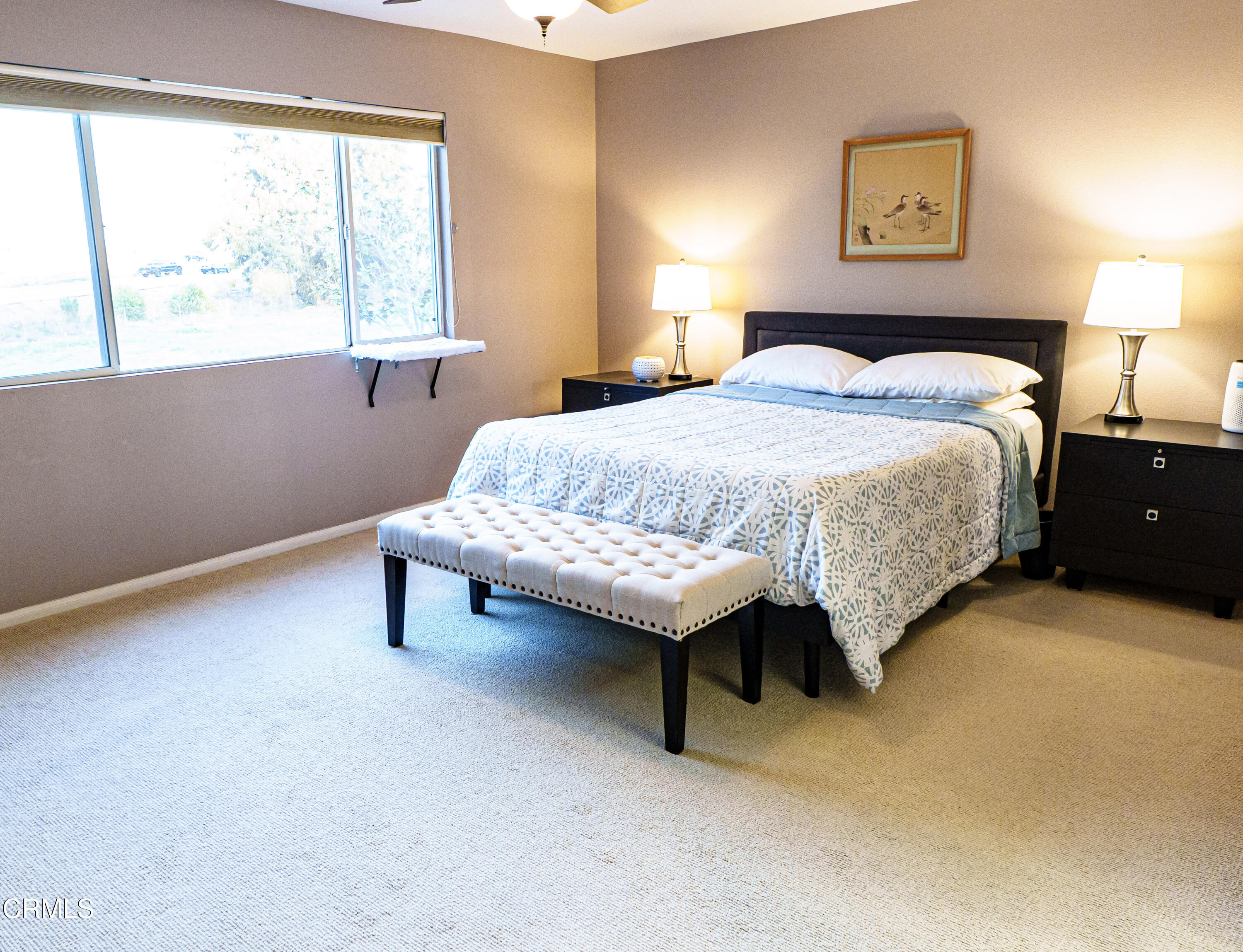 3840 Shakespeare Drive Oxnard, CA 93033 - Photo 23 of 46 a spacious bedroom with a bed and a lamp next to a window