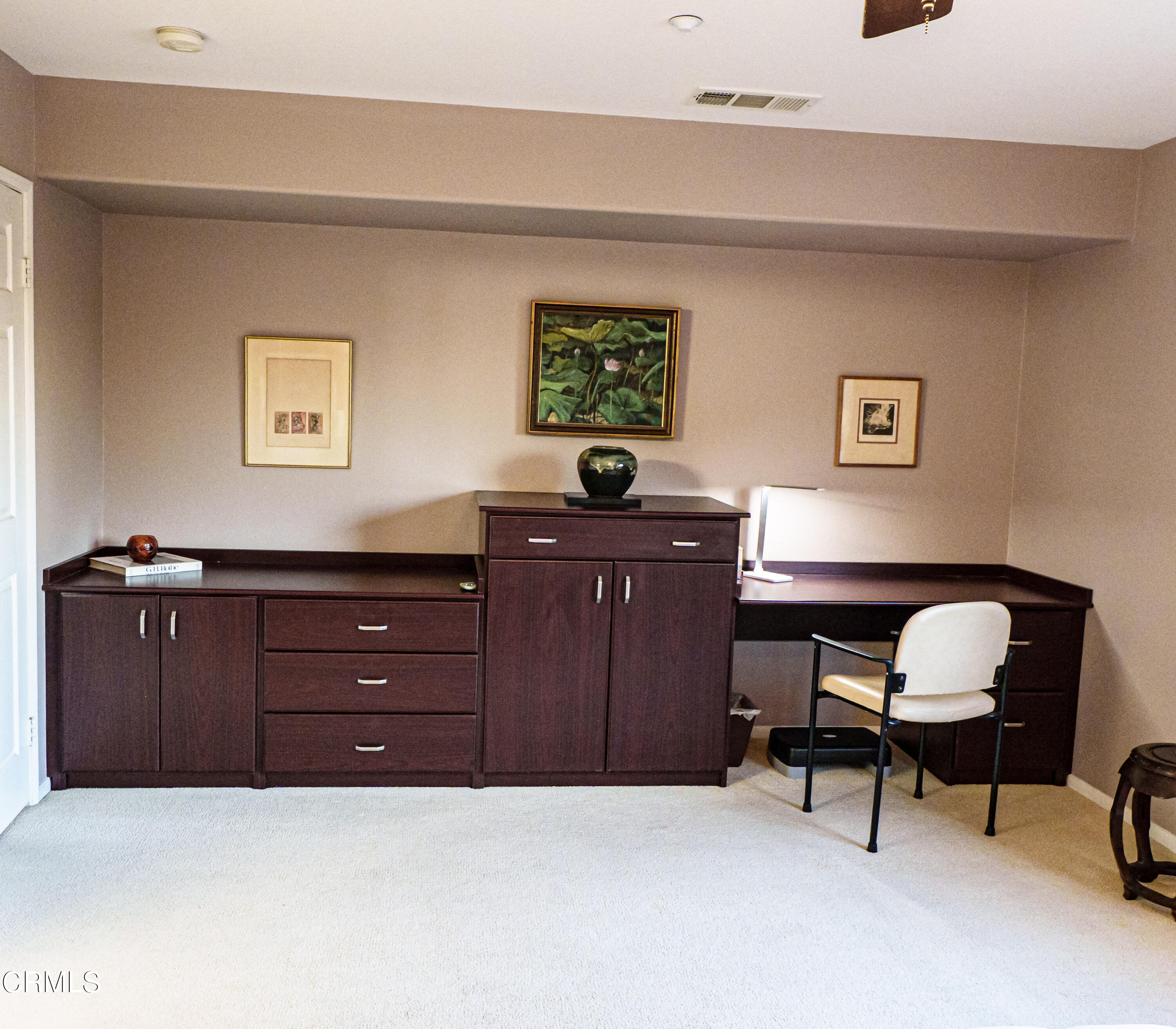 3840 Shakespeare Drive Oxnard, CA 93033 - Photo 26 of 46 a room with a dresser and a chair