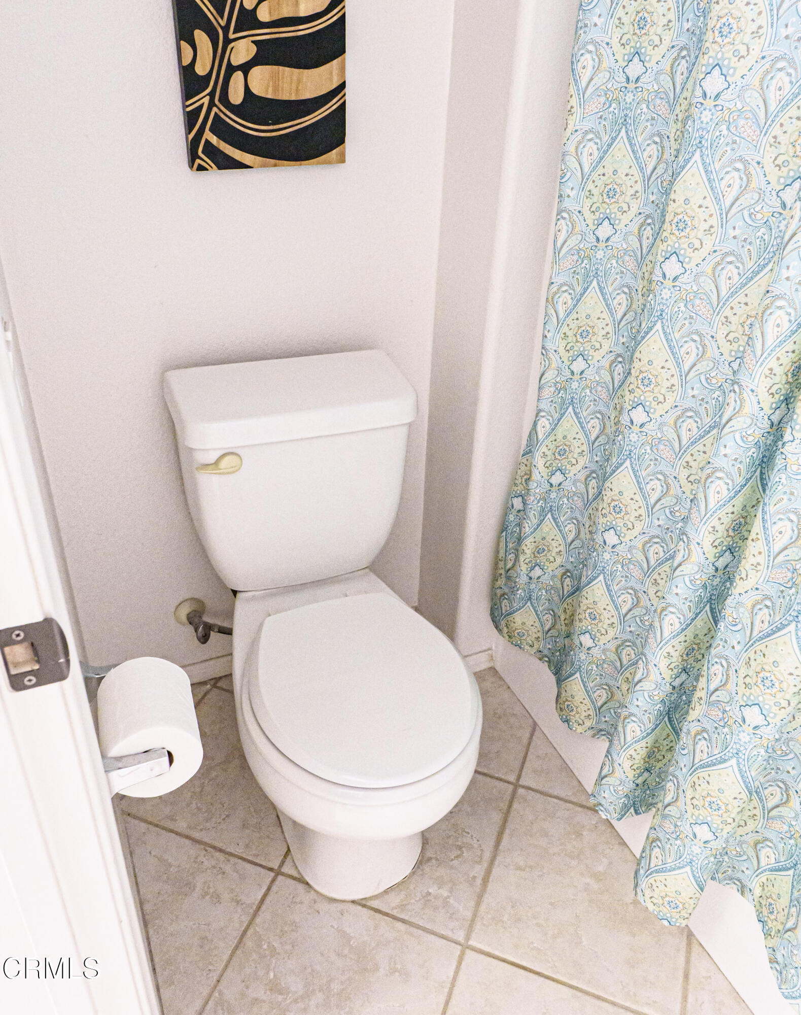 3840 Shakespeare Drive Oxnard, CA 93033 - Photo 29 of 46 a white toilet sitting next to a shower curtain