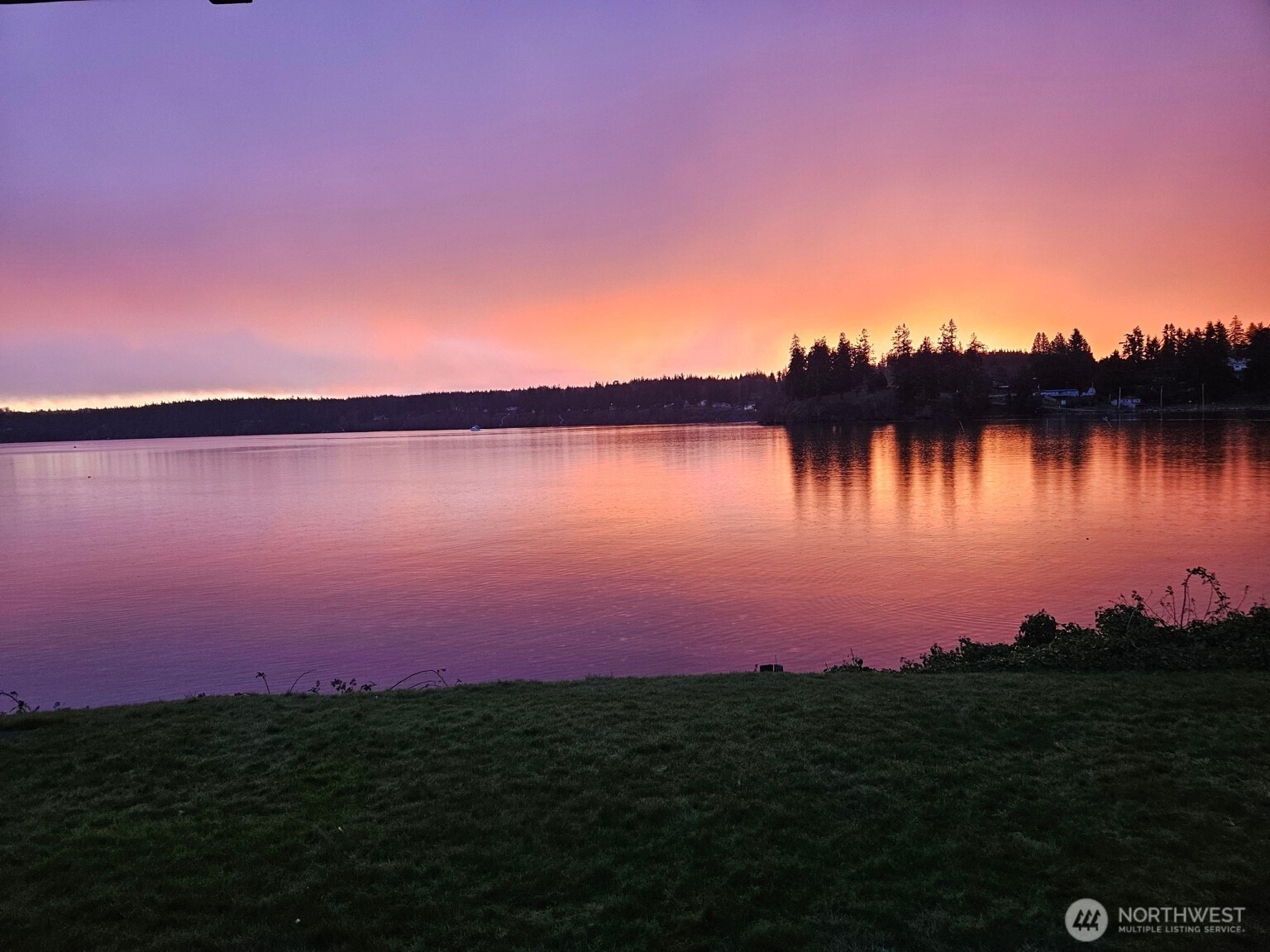 5341 South Bercot Road Freeland, WA 98249 - Photo 4 of 37 a view of a lake and sunset