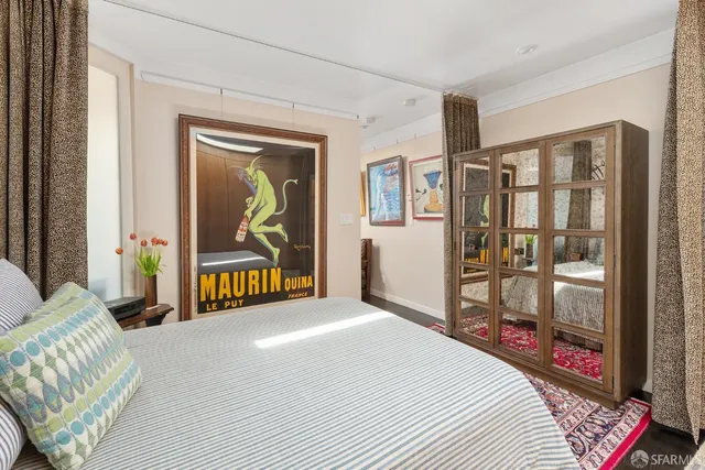 a bedroom with furniture and a gate