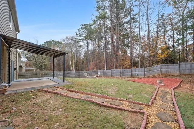 a backyard of a house with lots of green space