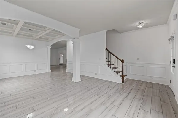 a view of an entryway with wooden floor